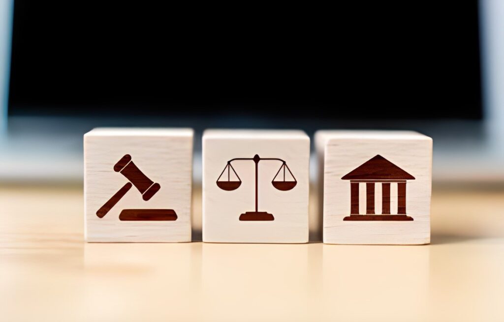 Three wooden blocks showing legal services we offer at Mirian Law Firm as our areas of practice.